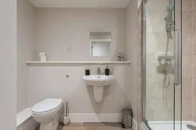 a bathroom with a toilet and a sink and a shower at Chic 1Bed in Hull City Centre near Hull College in Moffat