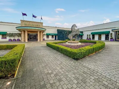 a building with a fountain in the middle of a courtyard at Lodge 4 - Uk51264 in Glasgow