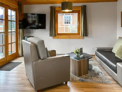 a living room with a couch and a table at Lodge 5 - Uk51251 in Glasgow
