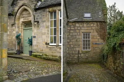 an old stone building with a green door and a street at Historic 1BR Home in Culross Near Filming Sites in Culross
