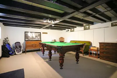 a room with a pool table and some furniture at Old Argyll House in Rashfield