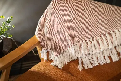 a blanket on the back of a chair at Boutique Studio Near Stirling in Cambusbarron