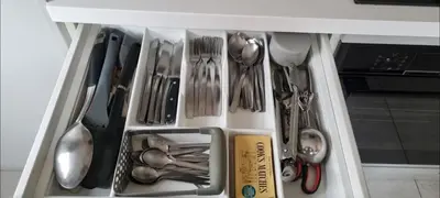 a drawer filled with utensils in a refrigerator at Stylish, Modern 3 bedroom house, free parking x 2 in Mansewood