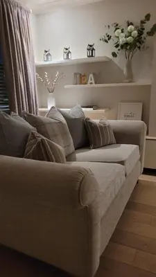 a living room with a couch in a room at Stylish, Modern 3 bedroom house, free parking x 2 in Mansewood