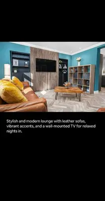 a living room with a couch and a coffee table at 2BR bed home peaceful central area free parking in Oban