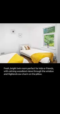a bedroom with a bed with a yellow blanket and a window at 2BR bed home peaceful central area free parking in Oban