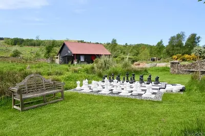 a group of white and black items on a grass field at The Steading In The Park in Stirling