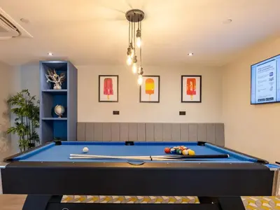 a pool table in a living room at For Students Only West End in Glasgow in Glasgow
