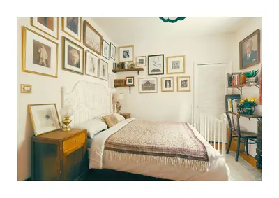 a bedroom with a bed and pictures on the wall at Historic Hideaway - Dean Village in Edinburgh