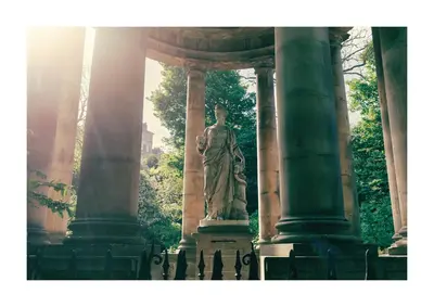 a statue of a woman standing between two columns at Historic Hideaway - Dean Village in Edinburgh