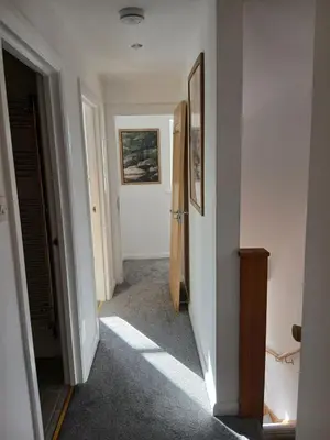 a hallway with a hallway leading into a room at Fabulous 4 Bed House in Leiston in Moffat