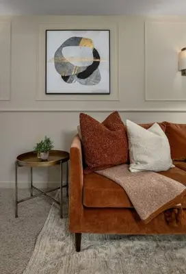 a living room with a couch and a table at Kilted Quarter by The Wallace Monument in Stirling