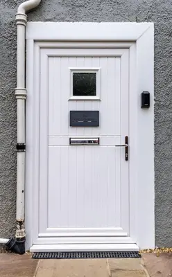 a white garage door with a window on it at Kilted Quarter by The Wallace Monument in Stirling