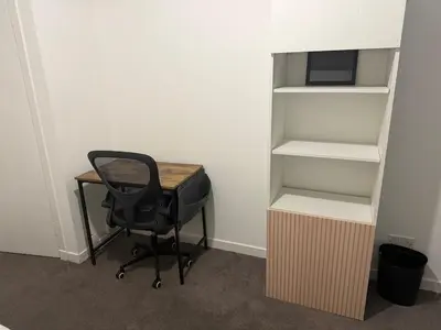 a desk and a chair in an empty room at West End Stay by Kelvingrove in Glasgow
