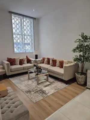 a living room with two couches and a table at Modern & Cozy Apartment in the Heart of the City in Moffat