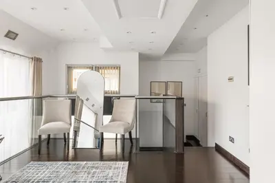 a dining room with a table and chairs at New! Modern Wapping 1BR Flat near Tower Bridge in Moffat