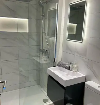 a white bathroom with a sink and a shower at Luxury Lodge 18 by Ashgrove Leisure in Moffat