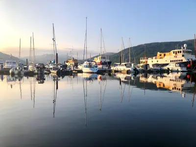 a group of boats are docked in a harbor at Heather Lodge with Hot Tub in Hunters Quay