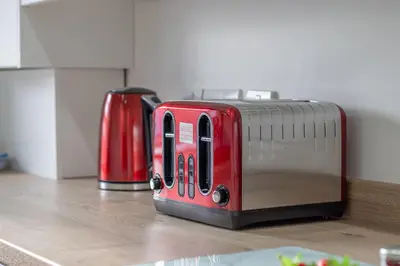two toasters sitting on a counter in a kitchen at Betty's House - 3 bedroom in Coatbridge in Glenboig