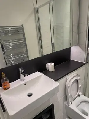a bathroom with a white sink and a toilet at Colindale Condominium in Moffat