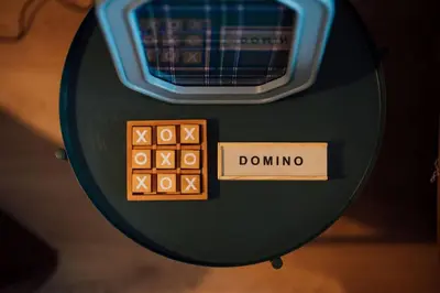 a close up of a box with dominoes on a table at Sea View, 2 Bed Apartment, Central Largs in Largs