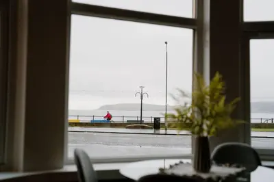 a window with a view of the ocean from a table at Sea View, 2 Bed Apartment, Central Largs in Largs