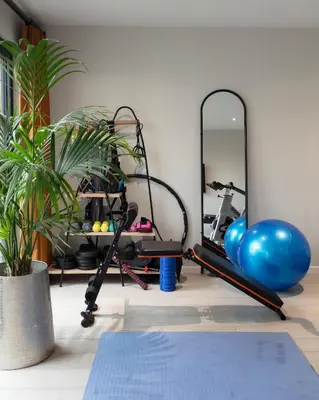 a gym with a mirror and a exercise bike at Stylish Retreat Auchterarder in Auchterarder