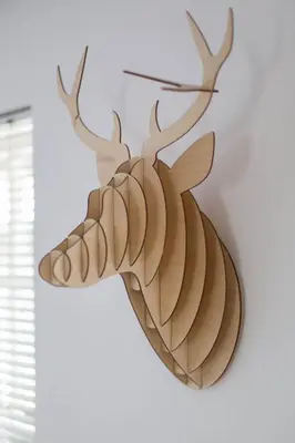 a wooden reindeer head hanging on a wall at Modern Grassmarket Apartment in Edinburgh