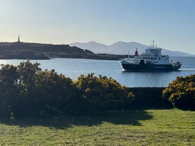 a boat in a large body of water at Sandvilla Guesthouse in Oban