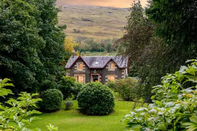 an old house in the middle of a garden at Mansefield House in Arrochar