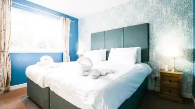 a bedroom with a bed with stuffed animals on it at The Inn at Kippen in Kippen