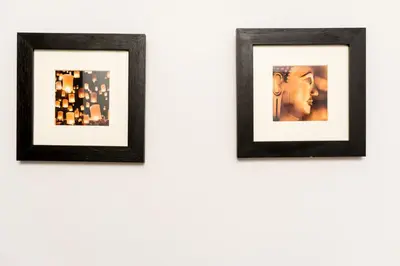 three framed photographs hanging on a white wall at Luxury New Town 1 Bed Apartment in Edinburgh