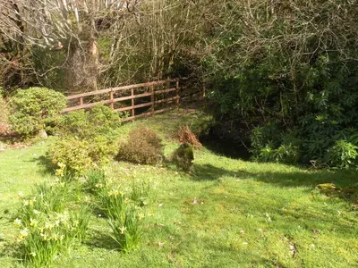 a wooden fence in the middle of a field at McHugh and Loudon Cottages in Saint Catherines