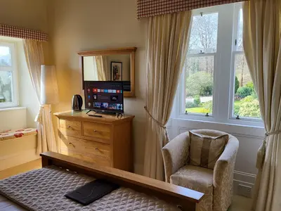 a room with a desk and a chair and a window at Rudha-na-Craige in Inveraray
