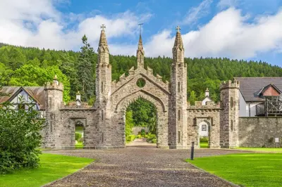 an old stone building with an archway in a park at The Kenmore Club in Kenmore