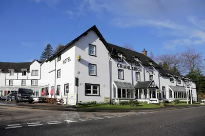 a large white building on the side of a street at BEST WESTERN The Crianlarich Hotel in Crianlarich