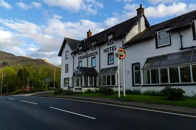 a white building on the side of a road at BEST WESTERN The Crianlarich Hotel in Crianlarich