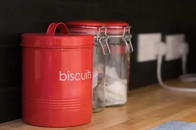 a red thermos sitting on top of a table at Blair Drummond Holiday Home in Doune
