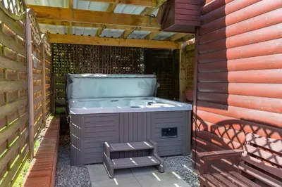 a jacuzziificialificialificialificialificialificialificialificialificialificialificial at Loch Lomond Luxury Lodges in Drymen