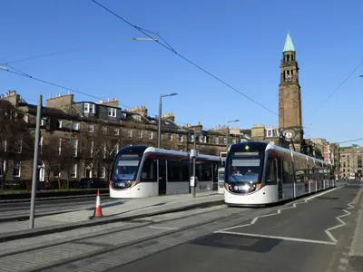 two trains on the tracks in a city at Montgomery Apartments - Stevensons in Edinburgh