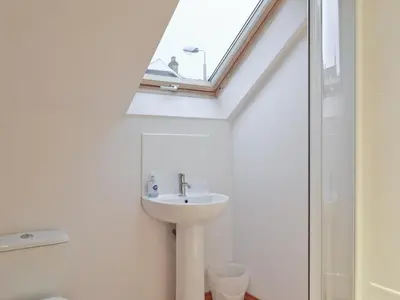 a bathroom with a sink and a skylight at Bruichladdich in Rothesay