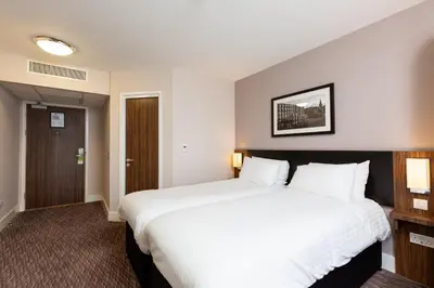 a large white bed in a hotel room at Sweet Chestnut, Dunfermline by Marston's Inns in Dunfermline