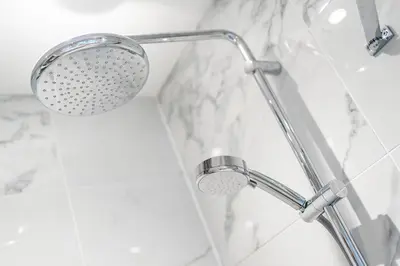 a shower with a shower head in a bathroom at The Pines - Luxury 3-Bed Apartment Near Golf & Spa, Gleneagles, Auchterarder in Auchterarder