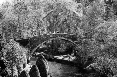 a black and white photo of a bridge over a river at No5 Ayr Beach - Coorie Doon Stays in Ayr