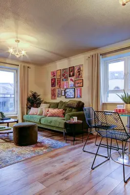 a living room with a green couch and chairs at No5 Ayr Beach - Coorie Doon Stays in Ayr