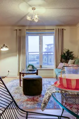 a living room with a large window and a couch at No5 Ayr Beach - Coorie Doon Stays in Ayr