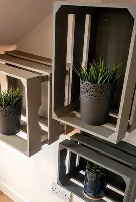 two potted plants on a shelf in a room at Boat House Super Suites in Rothesay