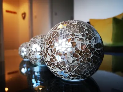 two silver balls sitting on top of a table at Mycosy 605 in Paisley
