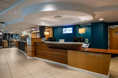 a lobby of a hospital with a reception counter at Holiday Inn Express - Glasgow - City Ctr Riverside by IHG in Glasgow