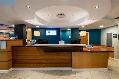 a lobby with a reception desk in a hospital at Holiday Inn Express - Glasgow - City Ctr Riverside by IHG in Glasgow